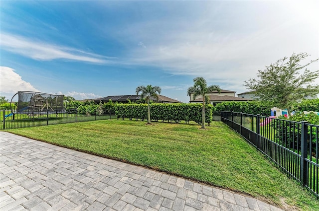 8940 Royal River Cir, Parrish, FL 34219 - view of yard featuring a trampoline and a patio