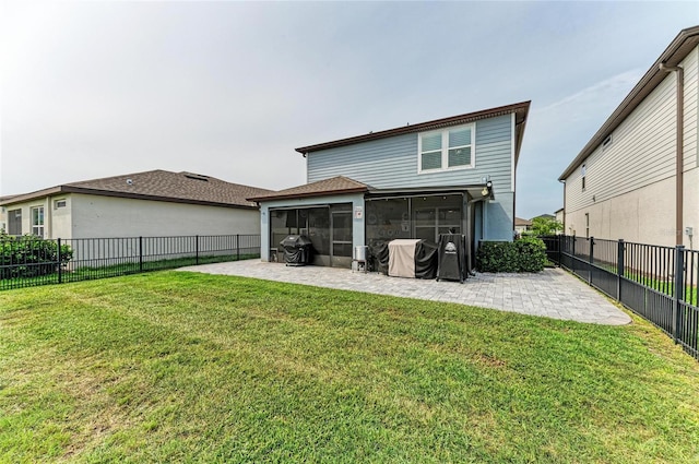 8940 Royal River Cir, Parrish, FL 34219 - rear view of house with a sunroom and a patio area