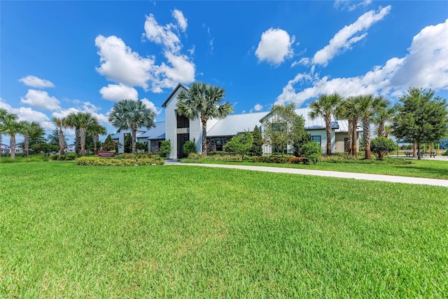 8940 Royal River Cir, Parrish, FL 34219 - view of front of property featuring a front yard and metal roof