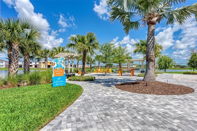 8940 Royal River Cir, Parrish, FL 34219 - view of property's community with curved driveway