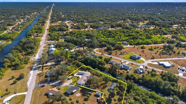 31 Twig Ct, Port Charlotte, FL 33954 - aerial view of property and surrounding area featuring property parcel outlined and a heavily wooded area