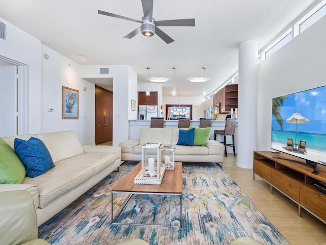 6512 Midnight Pass Rd Unit 301, Sarasota, FL 34242 - living room with a ceiling fan and wood finished floors