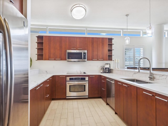 6512 Midnight Pass Rd Unit 301, Sarasota, FL 34242 - kitchen featuring open shelves, appliances with stainless steel finishes, a sink, pendant lighting, and light stone countertops