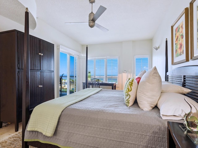 6512 Midnight Pass Rd Unit 301, Sarasota, FL 34242 - bedroom featuring a ceiling fan and a textured ceiling