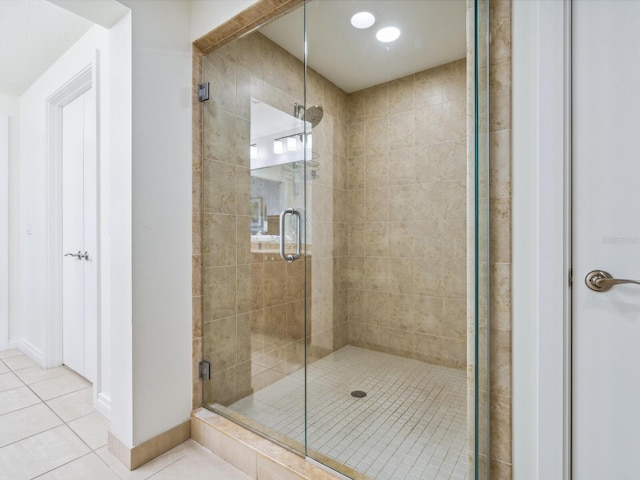 6512 Midnight Pass Rd Unit 301, Sarasota, FL 34242 - bathroom featuring tile patterned flooring, a shower stall, and baseboards