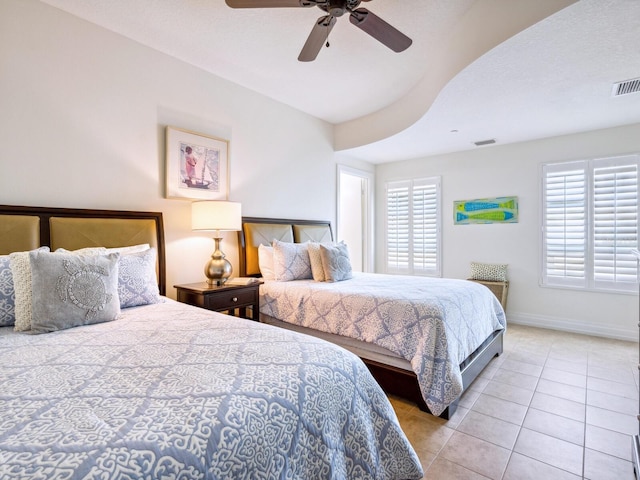 6512 Midnight Pass Rd Unit 301, Sarasota, FL 34242 - bedroom featuring multiple windows, tile patterned flooring, baseboards, and a ceiling fan