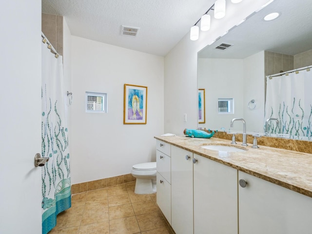 6512 Midnight Pass Rd Unit 301, Sarasota, FL 34242 - full bathroom featuring vanity, toilet, tile patterned flooring, baseboards, and a textured ceiling