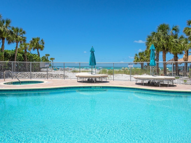 6512 Midnight Pass Rd Unit 301, Sarasota, FL 34242 - community pool featuring a community hot tub and a patio