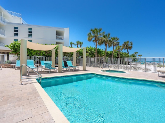6512 Midnight Pass Rd Unit 301, Sarasota, FL 34242 - community pool featuring a hot tub and a patio area