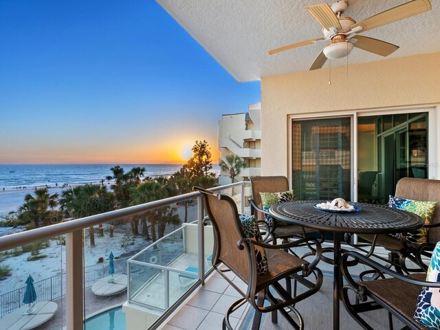 6512 Midnight Pass Rd Unit 301, Sarasota, FL 34242 - balcony at dusk with ceiling fan and a water view