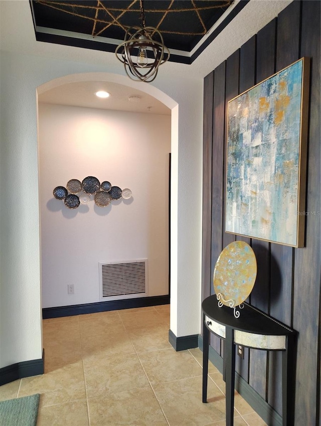 1241 Riverscape St Unit B, Bradenton, FL 34208 - corridor with arched walkways, light tile patterned flooring, and baseboards