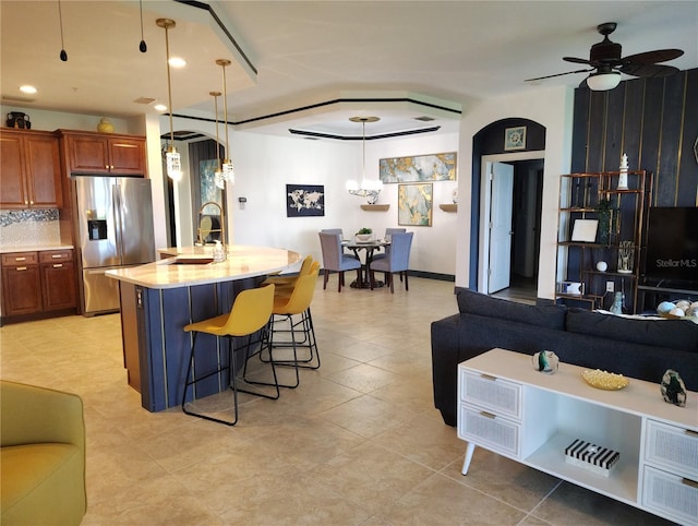 1241 Riverscape St Unit B, Bradenton, FL 34208 - kitchen with stainless steel fridge, open floor plan, a sink, and light countertops