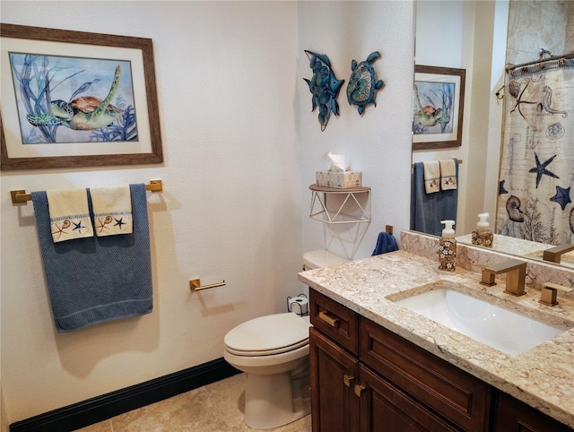 1241 Riverscape St Unit B, Bradenton, FL 34208 - bathroom featuring toilet, vanity, baseboards, and curtained shower