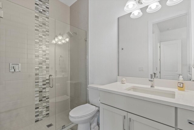 8982 Baroque Ter, Sarasota, FL 34240 - full bathroom with a shower stall, vanity, and toilet