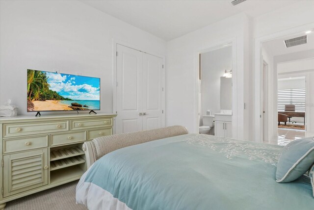 8982 Baroque Ter, Sarasota, FL 34240 - bedroom featuring ensuite bathroom and carpet flooring