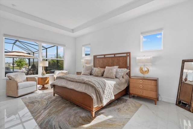8982 Baroque Ter, Sarasota, FL 34240 - bedroom with light marble finish flooring and baseboards