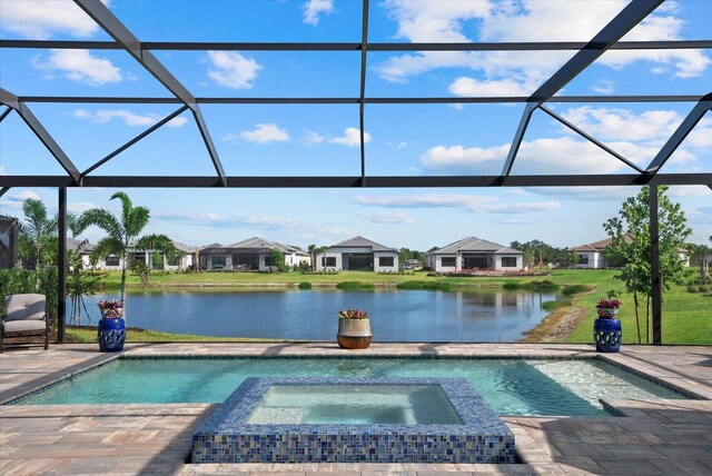 8982 Baroque Ter, Sarasota, FL 34240 - view of pool with a water view, glass enclosure, and a patio area