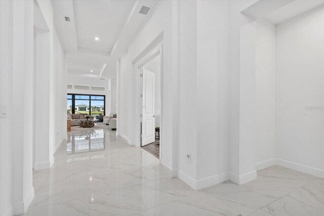 8982 Baroque Ter, Sarasota, FL 34240 - corridor featuring marble tiled floors, baseboards, and recessed lighting