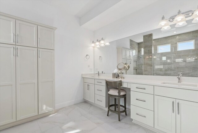 8982 Baroque Ter, Sarasota, FL 34240 - bathroom with a walk in shower, vanity, marble look tiles, and baseboards