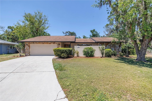 435 Whispering Oaks Ct, Sarasota, FL 34232 - ranch-style house featuring an attached garage, concrete driveway, a front yard, and stone siding