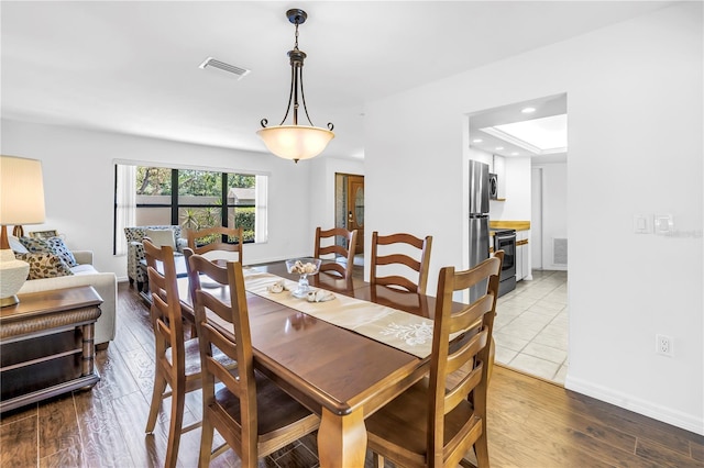 435 Whispering Oaks Ct, Sarasota, FL 34232 - dining room featuring wood finished floors, recessed lighting, and baseboards