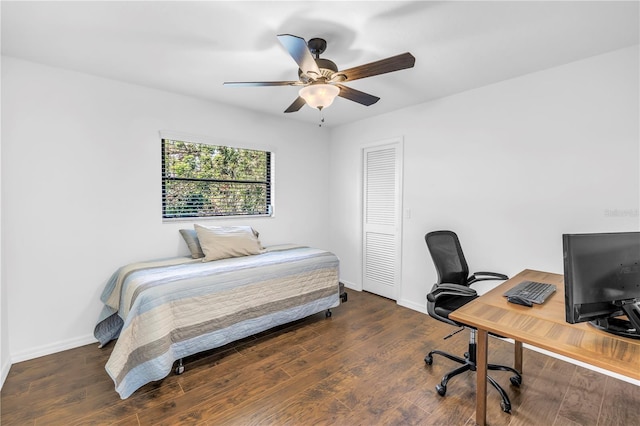 435 Whispering Oaks Ct, Sarasota, FL 34232 - bedroom featuring a desk, baseboards, and wood finished floors