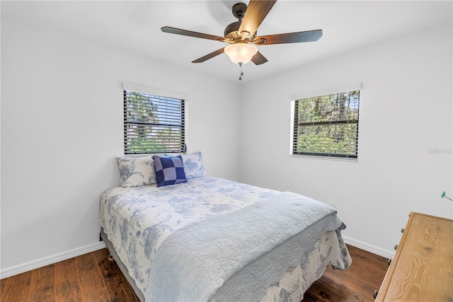 435 Whispering Oaks Ct, Sarasota, FL 34232 - bedroom featuring baseboards, wood finished floors, and a ceiling fan