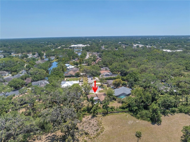 435 Whispering Oaks Ct, Sarasota, FL 34232 - aerial overview of property's location with a heavily wooded area and nearby suburban area