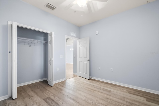 17118 Vardon Ter Unit 404, Bradenton, FL 34211 - unfurnished bedroom with wood finished floors, a closet, ceiling fan, and baseboards