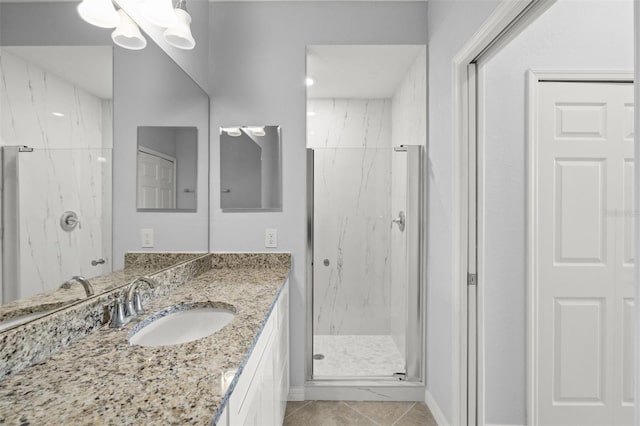 17118 Vardon Ter Unit 404, Bradenton, FL 34211 - bathroom featuring a marble finish shower, vanity, and tile patterned floors