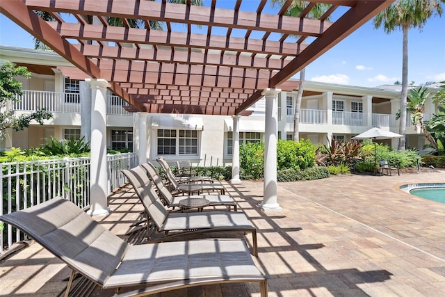 3702 54th Dr W Unit 102, Bradenton, FL 34210 - view of patio featuring a pergola and an outdoor pool