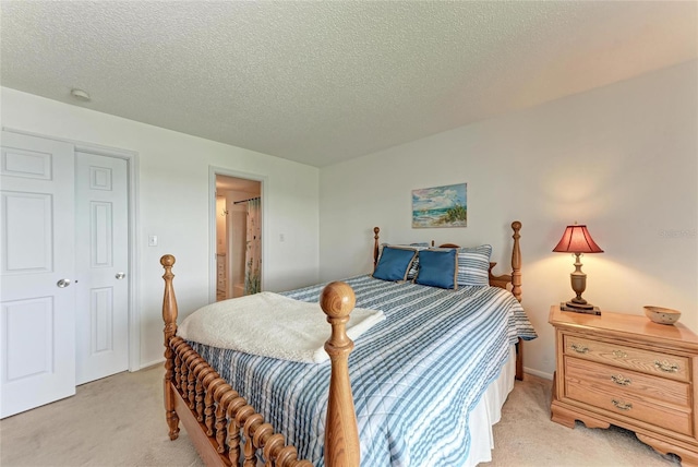 3801 Lake Bayshore Dr Unit H413, Bradenton, FL 34205 - bedroom featuring light colored carpet and a textured ceiling