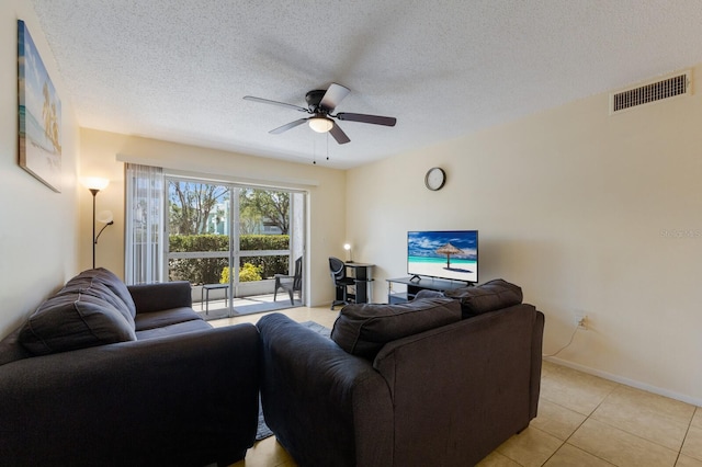 3253 Beneva Rd Unit 103, Sarasota, FL 34232 - living room with ceiling fan, light tile patterned floors, a textured ceiling, and baseboards