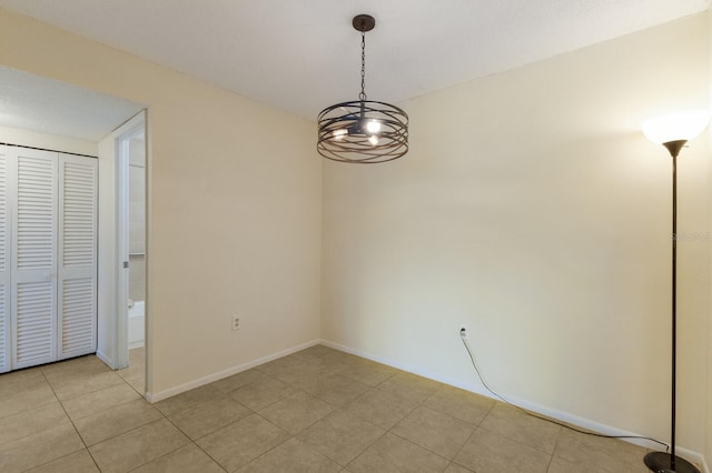 3253 Beneva Rd Unit 103, Sarasota, FL 34232 - unfurnished dining area with light tile patterned floors and baseboards