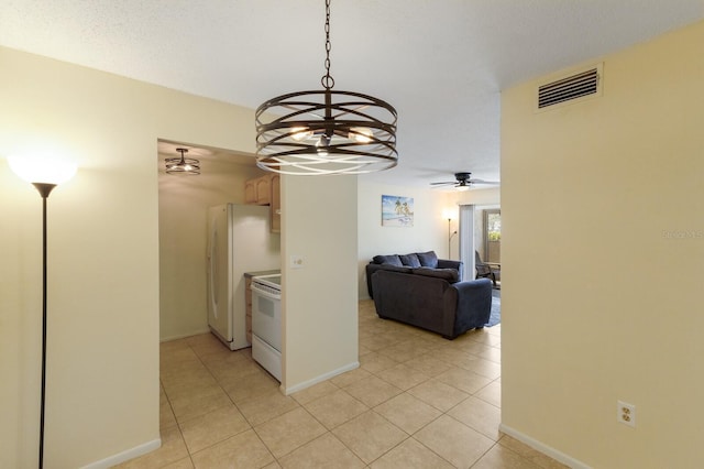 3253 Beneva Rd Unit 103, Sarasota, FL 34232 - kitchen featuring white appliances, a chandelier, light tile patterned flooring, a ceiling fan, and baseboards