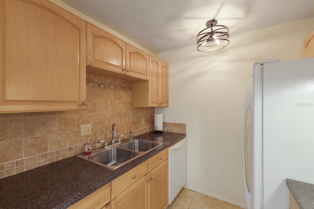 3253 Beneva Rd Unit 103, Sarasota, FL 34232 - kitchen with white appliances, a sink, light brown cabinets, dark countertops, and tasteful backsplash
