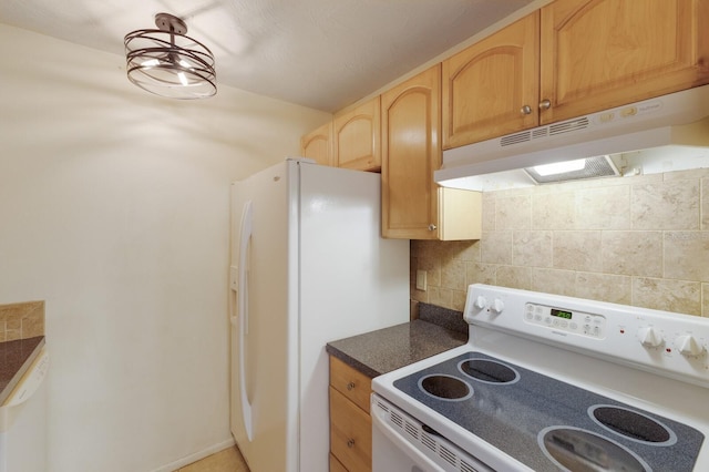 3253 Beneva Rd Unit 103, Sarasota, FL 34232 - kitchen with white appliances, under cabinet range hood, dark countertops, decorative backsplash, and light brown cabinetry