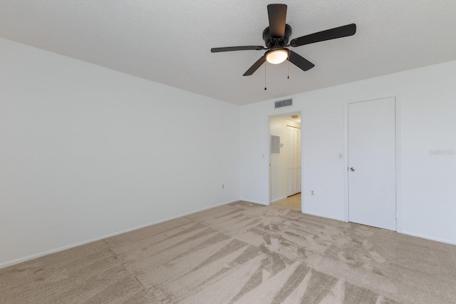 3253 Beneva Rd Unit 103, Sarasota, FL 34232 - unfurnished bedroom with light carpet, ceiling fan, and baseboards