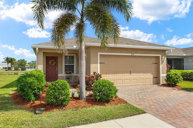5358 Shell Mound Cir, Punta Gorda, FL 33982 - ranch-style house with stucco siding, a garage, decorative driveway, and a front yard
