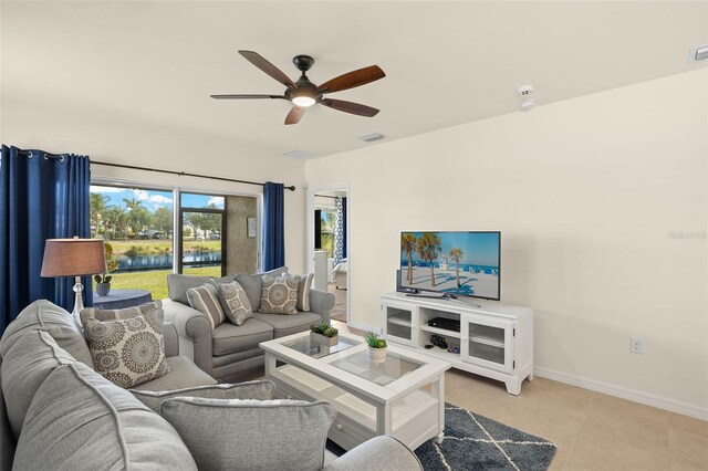 5358 Shell Mound Cir, Punta Gorda, FL 33982 - living room with ceiling fan, baseboards, and light tile patterned flooring