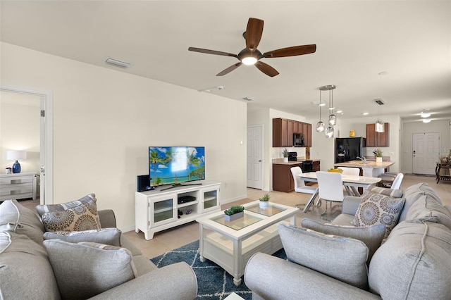 5358 Shell Mound Cir, Punta Gorda, FL 33982 - living room with a ceiling fan and baseboards
