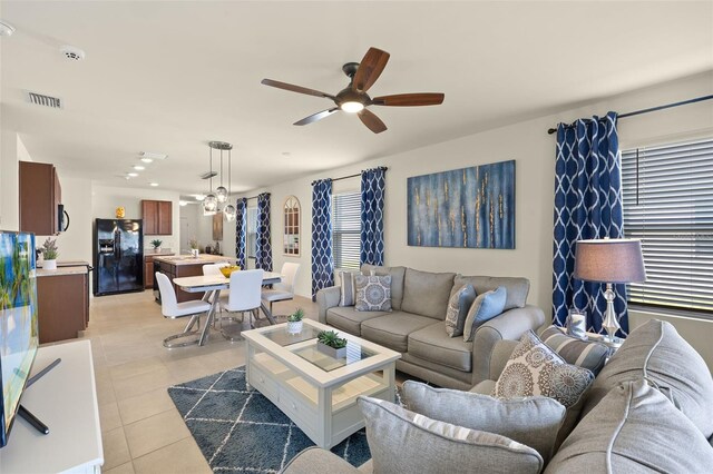 5358 Shell Mound Cir, Punta Gorda, FL 33982 - living area with ceiling fan and light tile patterned flooring