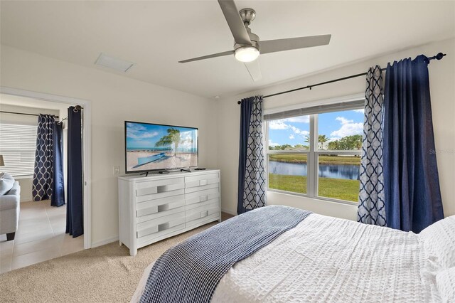 5358 Shell Mound Cir, Punta Gorda, FL 33982 - bedroom featuring light carpet, baseboards, and a ceiling fan