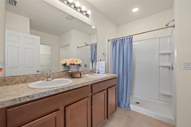 5358 Shell Mound Cir, Punta Gorda, FL 33982 - full bath featuring tile patterned floors, a tile shower, and double vanity