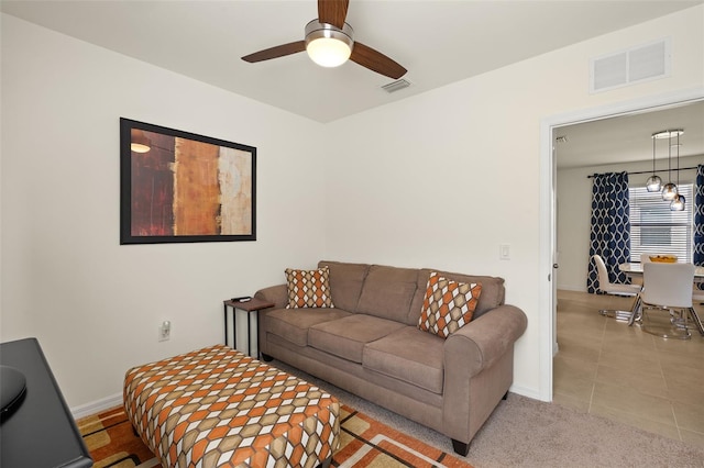 5358 Shell Mound Cir, Punta Gorda, FL 33982 - living room with ceiling fan, baseboards, and tile patterned floors