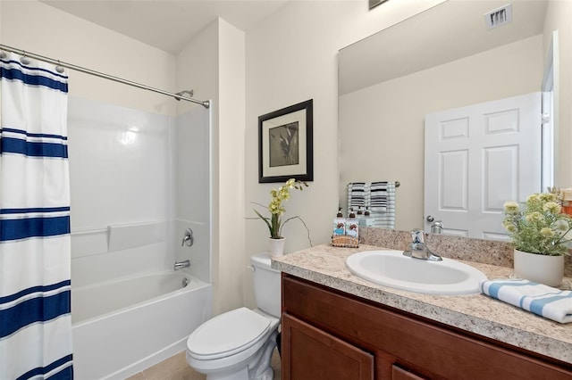 5358 Shell Mound Cir, Punta Gorda, FL 33982 - bathroom featuring vanity, toilet, shower / bath combination with curtain, and tile patterned flooring