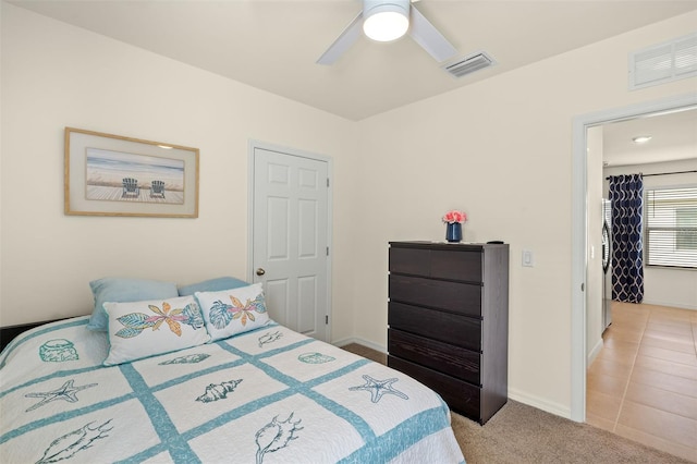 5358 Shell Mound Cir, Punta Gorda, FL 33982 - bedroom featuring light carpet, baseboards, and a ceiling fan