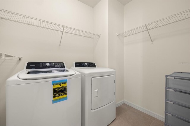 5358 Shell Mound Cir, Punta Gorda, FL 33982 - washroom with independent washer and dryer, baseboards, and light tile patterned flooring
