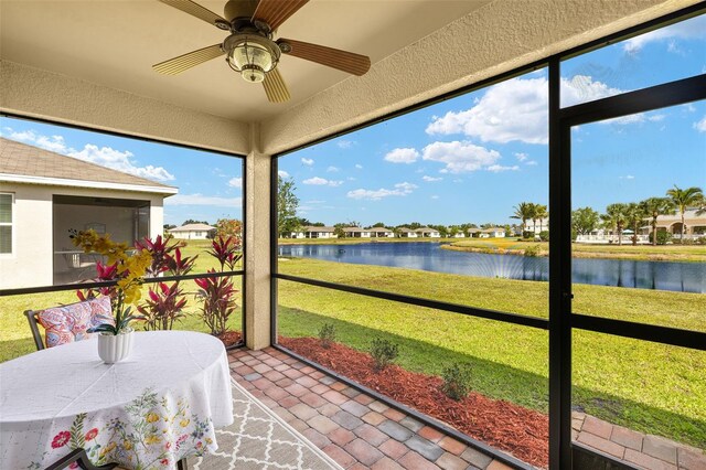 5358 Shell Mound Cir, Punta Gorda, FL 33982 - sunroom / solarium with a water view, a ceiling fan, and plenty of natural light