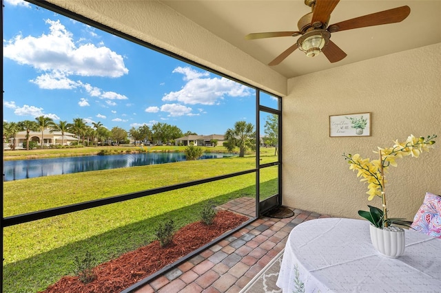 5358 Shell Mound Cir, Punta Gorda, FL 33982 - sunroom / solarium featuring a water view and ceiling fan